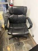 Leather High-Back Chair features prominent white stitching