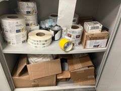 Shelf lot containing DLK Medical Solutions hand sanitizer wipes, rolls of shipping labels