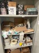 Shelf lot containing DLK Medical Solutions hand sanitizer wipes, rolls of shipping labels