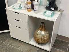 White mobile file cabinet features three storage drawers and an open shelf