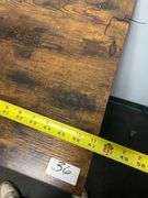 Industrial Bar Table featuring a rustic brown engineered wood top and a black metal frame