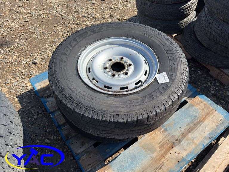 2- 245/75R16 Tires & Rims From A Trailer. (Rims Only. Tires Worn And Cracked)