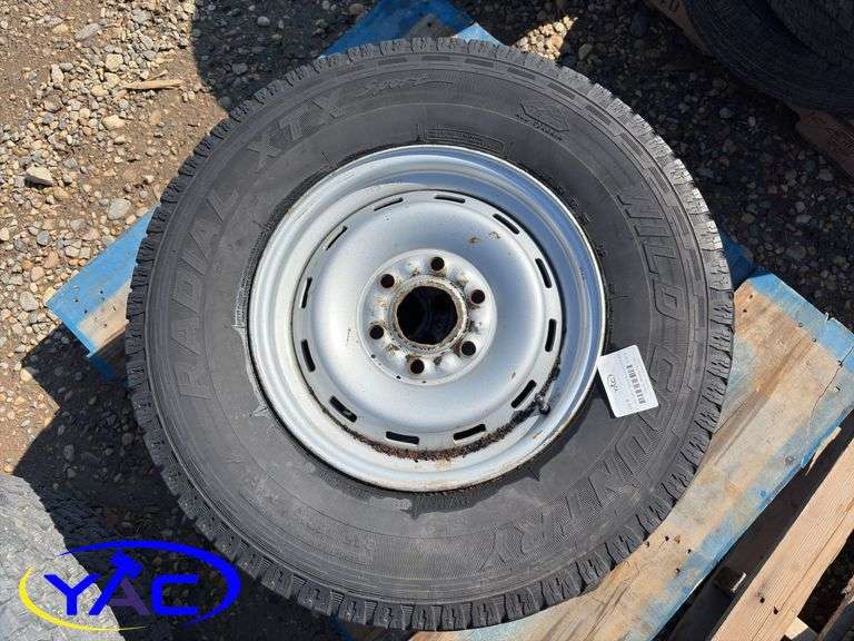 2- 245/75R16 Tires & Rims From A Trailer. (Rims Only. Tires Worn And Cracked)