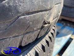 2- 245/75R16 Tires & Rims From A Trailer. (Rims Only. Tires Worn And Cracked)