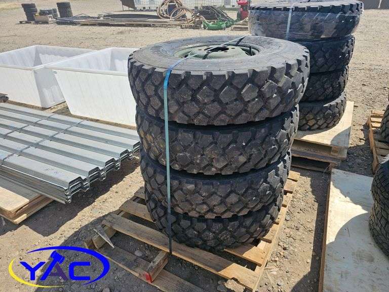4 - 9.00R16 Tires On Rims (BUYER MUST PAY 4X THE BID PRICE)