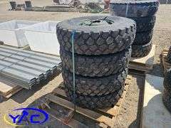 4 - 9.00R16 Tires On Rims (BUYER MUST PAY 4X THE BID PRICE)