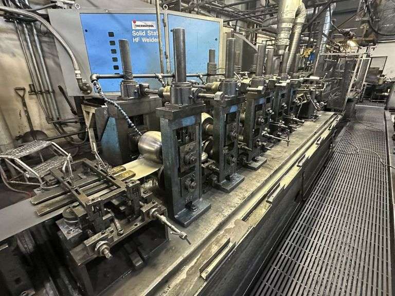 Auction #51015P - Two Complete Tube Manufacturing Lines: Grinders, Presses, Slitting Line, Finishing Equipment and Much More!