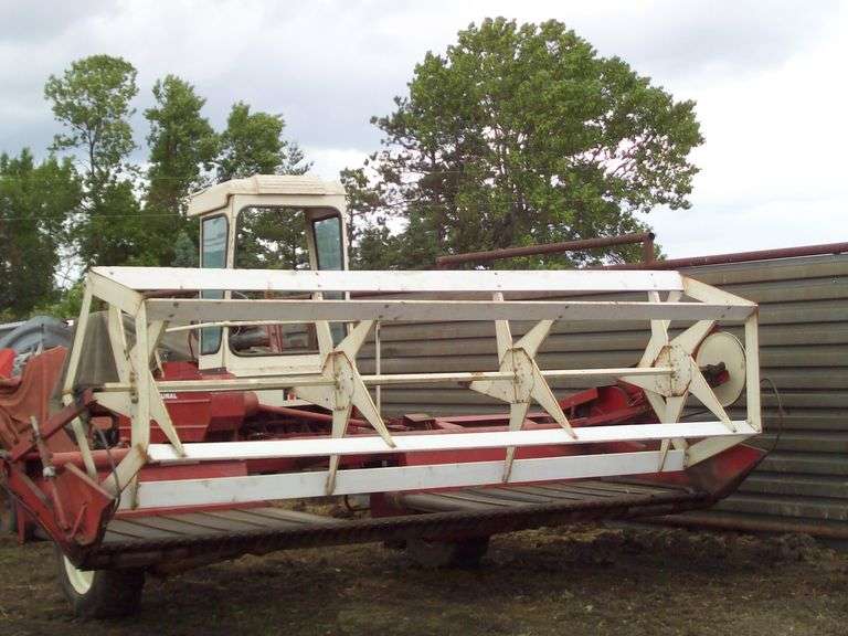 INTERNATIONAL 230 SELF PROPELLED WINDROWER 12.5L-20 DRIVE WHEELS, 6.70X15 TAIL WHEEL, 14' CUTTING WIDTH, VARIABLE SPEED DRIVE, 4 CYL IH ENGINE, CANVASES ARE GOOD, STORED INSIDE, WORKS AND RUNS, NO CONDITIONER,OWNED SINCE 1999, LOCATED HOLDINGFORD MN, BOB 320-248-2127