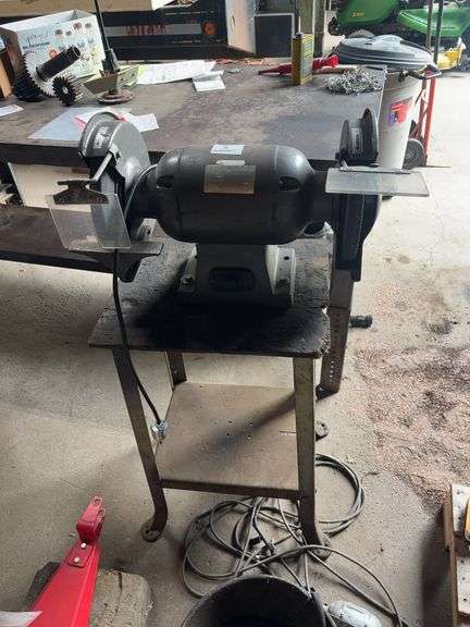 CUMMINS BENCH GRINDER ON TABLE.